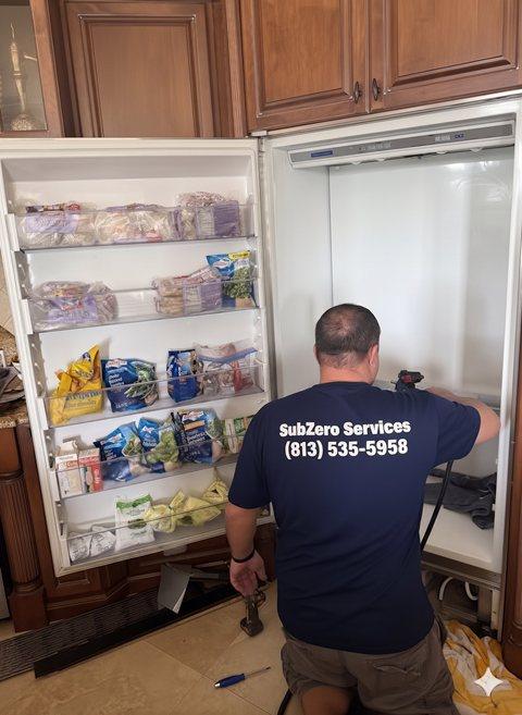 Certified Sub-Zero technician repairing a built-in freezer in Chicago